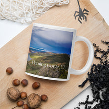 Load image into Gallery viewer, White 20 oz, glossy mug with Flaming Gorge image and halloween decor 
