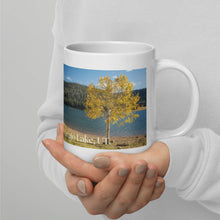 Load image into Gallery viewer, White 20-oz glossy mug with Navajo Lake image, handle on right.
