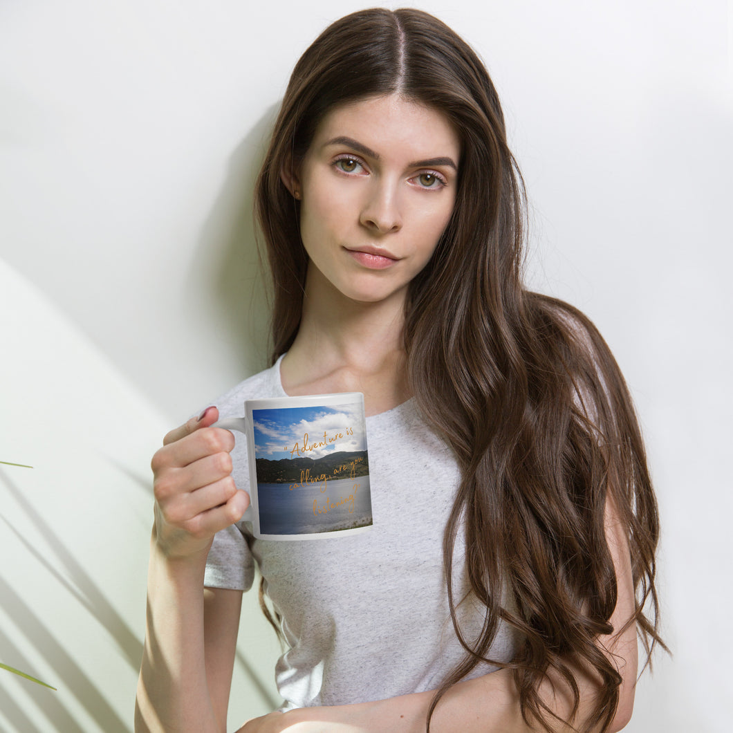 A woman handle a white 20 oz  glossy mug with Rockport Reservoir image.