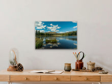 Load image into Gallery viewer, &#39;Oasis of Crystalline Water&#39; - 16&quot;x24&quot; on a cream-colored wall, enhancing a hallway table with various homely objects.
