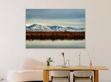 Load image into Gallery viewer, &#39;Stillness - Limited Edition Fine Art Print&#39; - 40&quot;x60&quot; displayed on a soft pink wall in a modern reception area with a small wooden desk.
